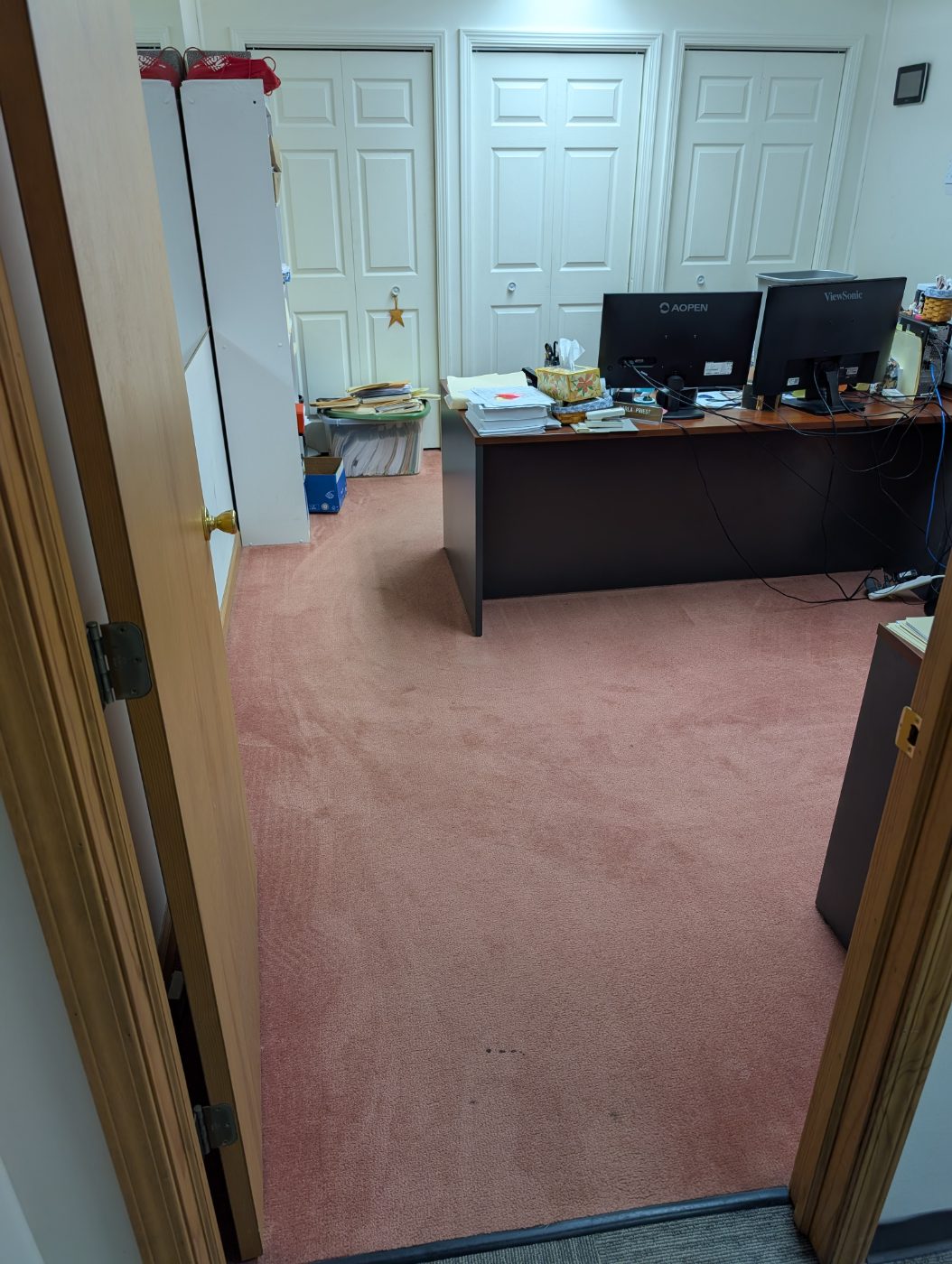 Carpet in Bloomington, IN before professional cleaning, showing dirt and traffic-lane wear